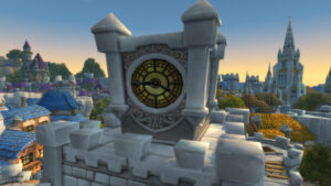 A stone clock tower overlooking a sunlit town
